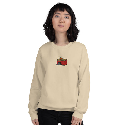 Woman wearing the sand Kotatsu Cat embroidered sweatshirt